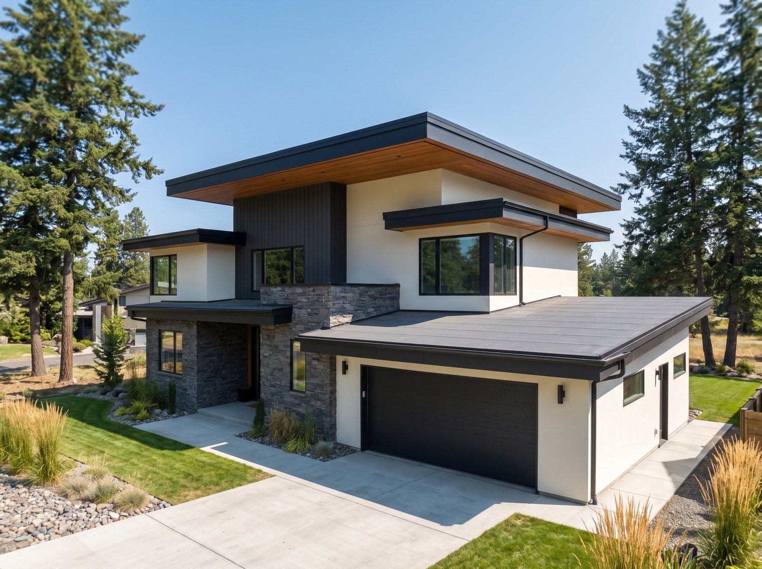 Low-slope TPO membrane roof on a modern Greater Seattle home, seen from the driveway
