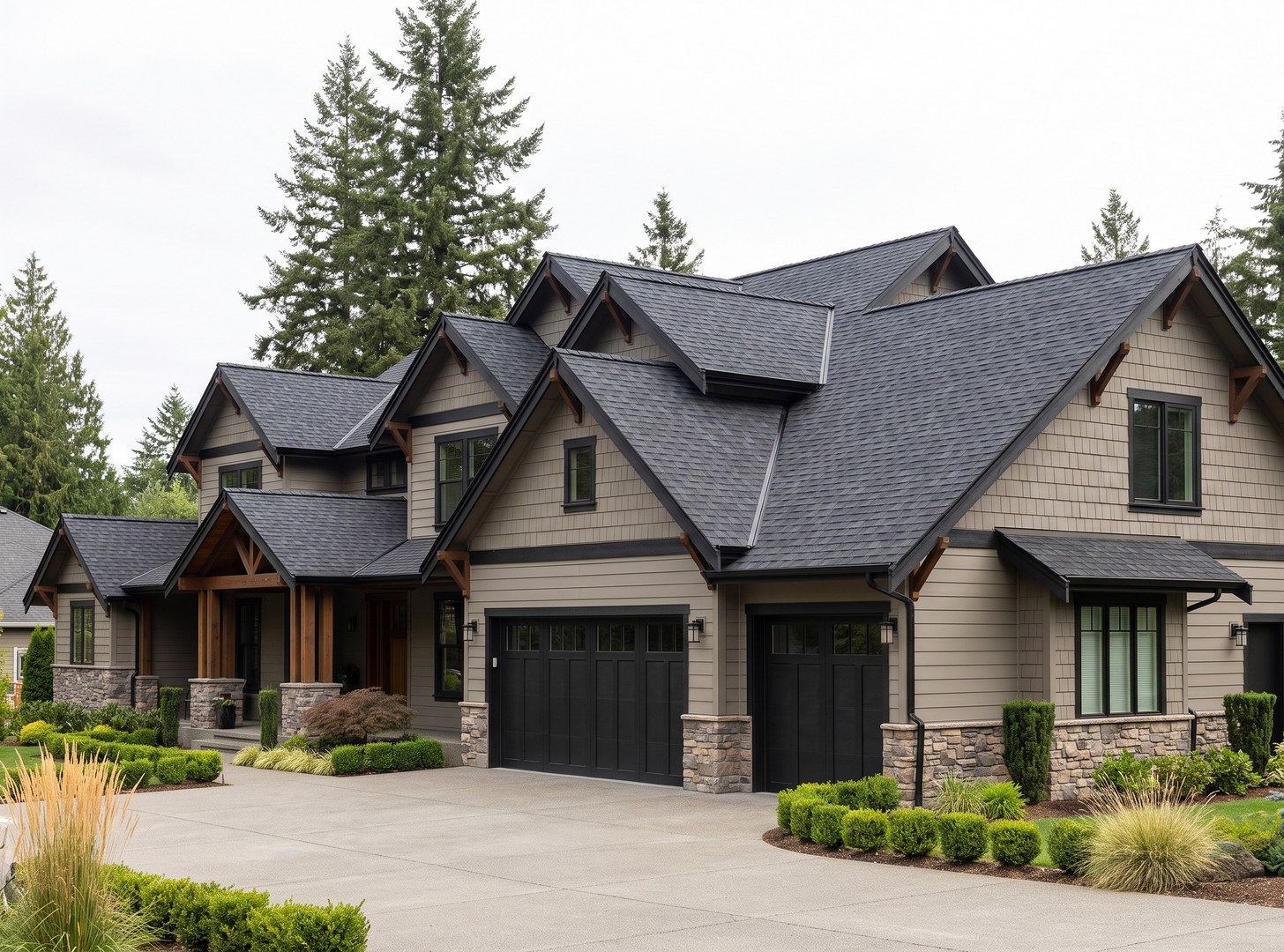 Charcoal architectural asphalt shingle roof on a large two-story Greater Seattle home, seen from the driveway