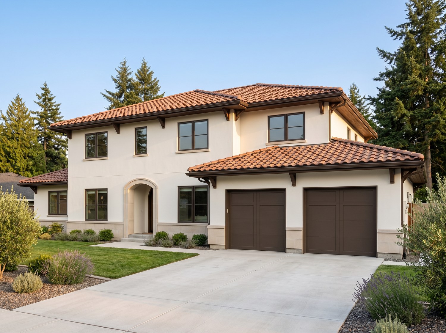 Barrel-profile concrete tile roof on a stucco Greater Seattle home, seen from the driveway